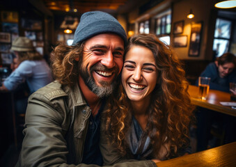 happy laughing couple relaxing in bar, going out on weekend - obrazy, fototapety, plakaty