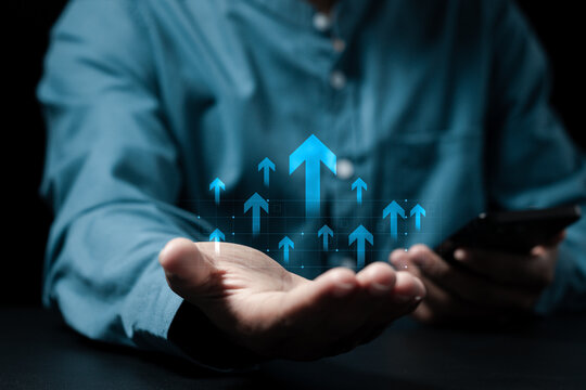 Business growth. Businessman show arrows up icon for analysis economic growth graph and financial data, global economic trend analysis, planning business strategy, digital marketing.