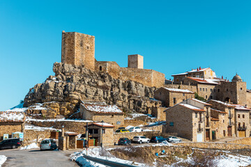 Fototapeta na wymiar View of the medieval village of Puertomingalvo, Teruel, Spain, with its castle.