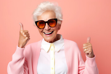 Happy senior woman looking at camera in thumbs up greeting gesture - obrazy, fototapety, plakaty
