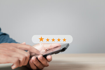 User take survey feedback online on application smartphone. Rate experience satisfaction for 5...