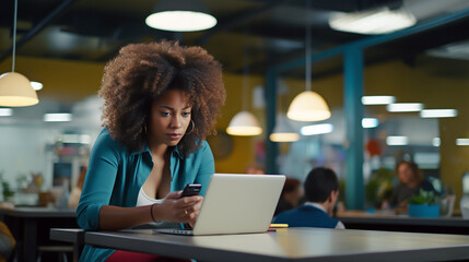 BUSINESS AFRICAN WOMAN WORKING WITH LAPTOP AND SMARTPHONE AT THE SAME TIME. image created by legal AI