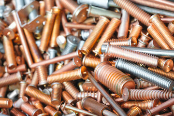 Texture background of metal products screws, nozzles, bolts and studs for welding equipment,...