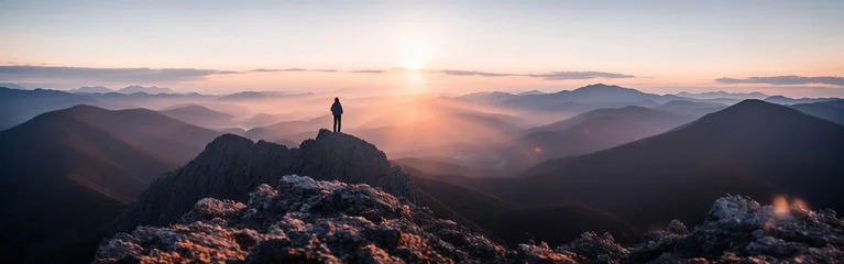 Foto op Plexiglas A tourist stands on the peak of a mountain, a man conquering the peak. Generative AI. © Nadejda