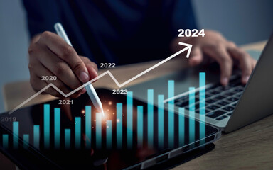 2023 change to 2024 business success concept. Businessman draws increase arrow graph corporate future  vision growth year 2023 to 2024. New Goals, Plans and Visions for Next Year welcome  2024.