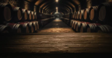 Rolgordijnen empty dark wooden tabletop for product display on blurred winery wine barrels cellar background © ronstik