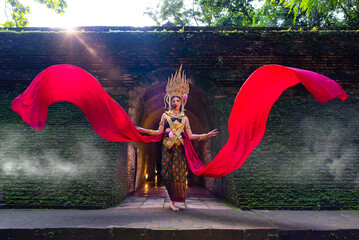 Beautiful woman in Apsara dancer costume traditional ASEAN culture at ancient temple. Halloween day...