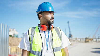 African american man builder standing with relaxed expression at street