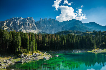Karersee, Carezza lake, is a lake in the Dolomites in South Tyrol, Italy know for its clear and vibrate blue water.