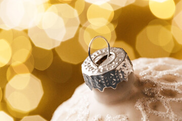 Christmas ball close-up against a background of sparkling garlands
