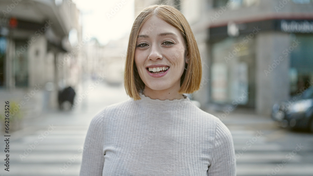 Poster young blonde woman smiling confident standing at street