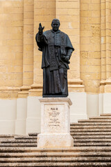 Gozo, Malta, May 3, 2023. Statue of Pope Pius IX in front of the , Notre-Dame-de-l'Assomption Cathedral in Rabat, Victoria,