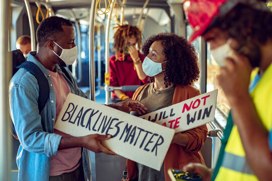 Diverse black rights activists going to a protest on the bus