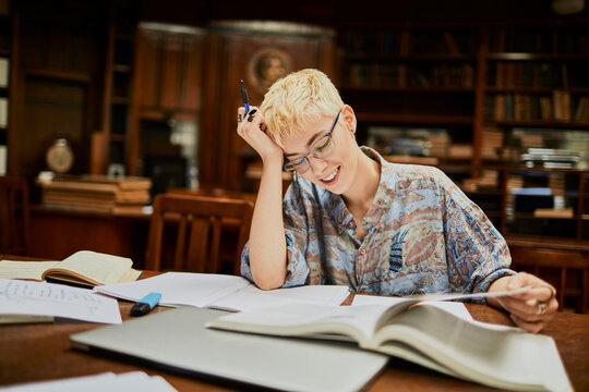 Young woman studying in a college library