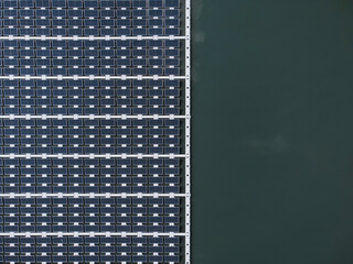 Solar power plant farm on beautifull lake. Floating solar panels providing green energy. Renewable energy.