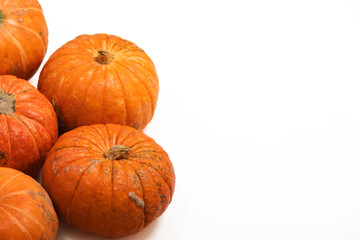 Fresh autumn orange pumpkins isolated on white background. Сoncept Halloween celebration background, fall harvest, minimalism holiday decoration template. Top view, flat lay, copy space