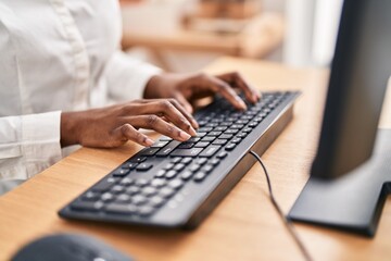 African american woman using computer keyboard at office - obrazy, fototapety, plakaty