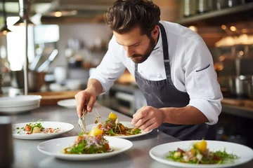 Foto op Plexiglas male chef serving food on a white plate working in a restaurant © Jorge Ferreiro