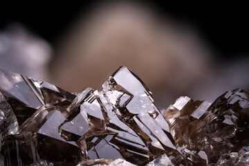 skeletal smoky quartz isolated on black background. macro detail close-up rough raw unpolished semi-precious gemstone.