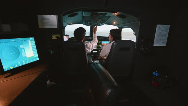 Student pilots prepare for the flight in the simulator