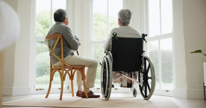 Sad, senior man and death of wife in home with wheelchair, window and memory of sitting together in living room. Elderly, couple and person mourning, loss and remember partner with grief on chair