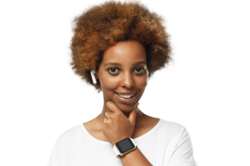 Young african american woman looking at camera, showing smartwatch with blank screen, wearing wireless earphones and blank white t-shirt