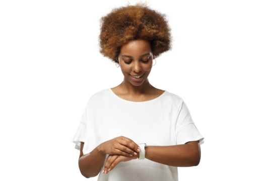 Young african american woman checking smartwatch, wearing wireless earphones and blank white t-shirt
