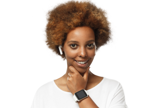 Young african american woman looking at camera, showing smartwatch with blank screen, wearing wireless earphones and blank white t-shirt