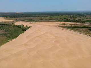 Aerial view of the sand dunes at the landscape protection area "Lomas de Arena" near Santa Cruz de la Sierra in the lowlands of Bolivia - Traveling and exploring South America