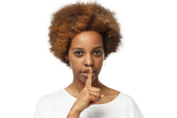 Shh! Young african american woman wearing blank white t-shirt and pressing index finger to lips as if asking other to keep silent about his secret