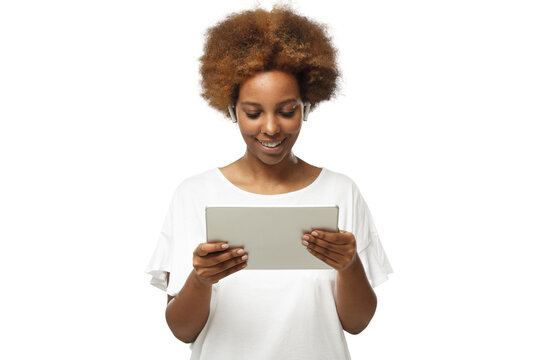 African american woman looking at screen of tablet