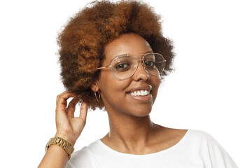 Smiling african american woman wearing glasses, touching her afro hair and looking at camera