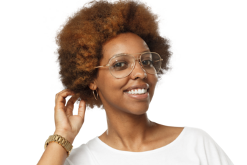 Smiling african american woman wearing glasses, touching her afro hair and looking at camera