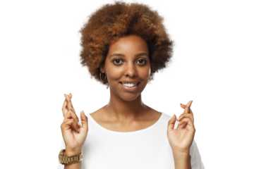 Portrait of lucky african woman looking at camera, crossing fingers for luck