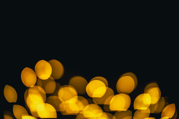background, texture. Yellow round bokeh on black background