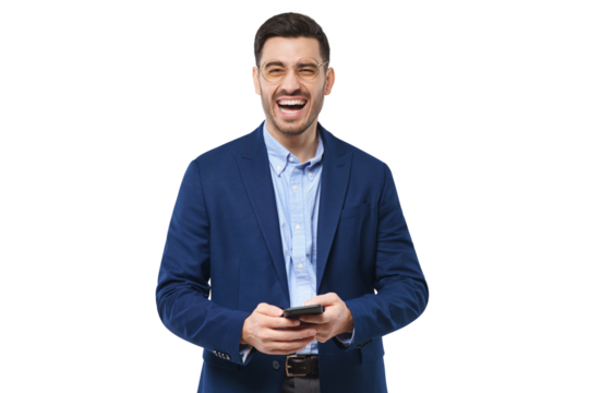 Young businessman laughing while holding phone in hands - Powered by Adobe