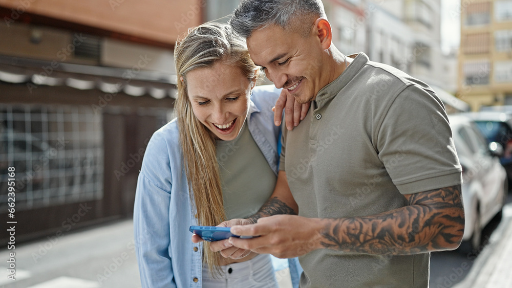 Sticker Man and woman couple watching video on smartphone laughing a lot at street