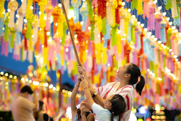 Asian families make wishes and hang lanterns during The Hundred Thousand Lantern Festival or Yi...