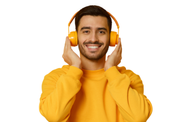 Smiling young man listening music, wearing yellow wireless headphones and sweatshirt, enjoying favorite song
