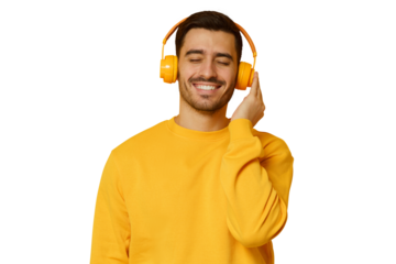 Happy young man listening music, wearing yellow wireless headphones and sweatshirt, enjoying favorite song with closed eyes