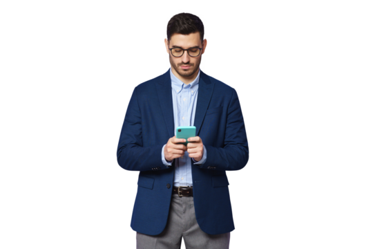 Serious young businessman wearing blue suit, looking at phone screen, chatting online, surfing the internet