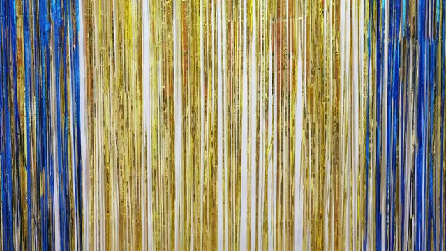 Gold and Blue New Year background in shining lights and shiny glitter sparkles.