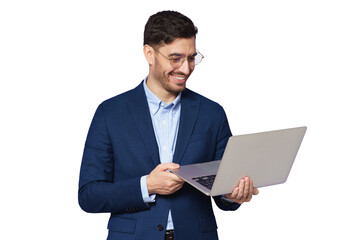 Young male teacher dressed in blue suit, wearing glasses, holding open laptop in hands, looking at screen