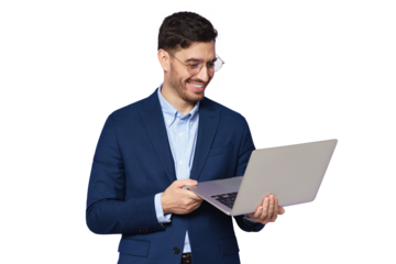 Young male teacher dressed in blue suit, wearing glasses, holding open laptop in hands, looking at screen