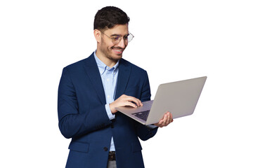 Young male teacher dressed in blue suit, wearing glasses, holding open laptop in hands, looking at...