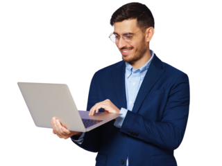 Young businmessman wearing trendy smart casual suit, standing with open laptop in hands, smiling at content on screen