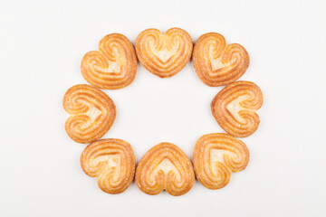 Top view of heart shaped biscuit on white background