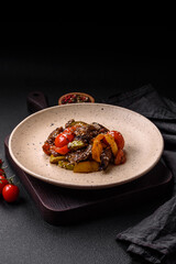 Warm salad with veal, tomatoes, peppers, zucchini, sesame, salt, spices and herbs