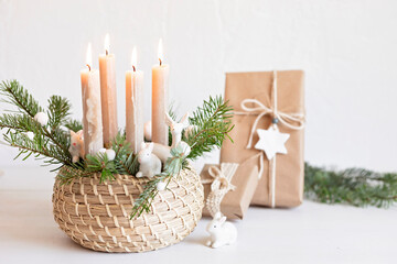 Handmade modern advent wreath with four candles lit every sunday before christmas. Traditional diy...