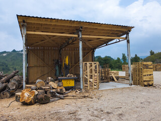 Fototapeta premium small sawmill next to the forest road